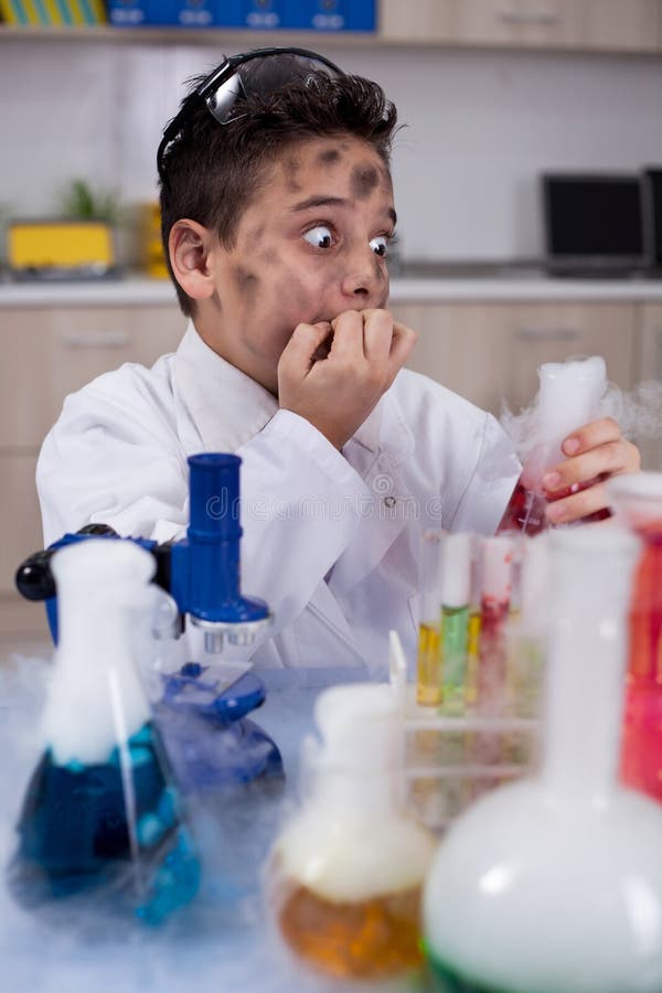 Little schoolboy working in chemistry lab. Little schoolboy working in chemistry lab