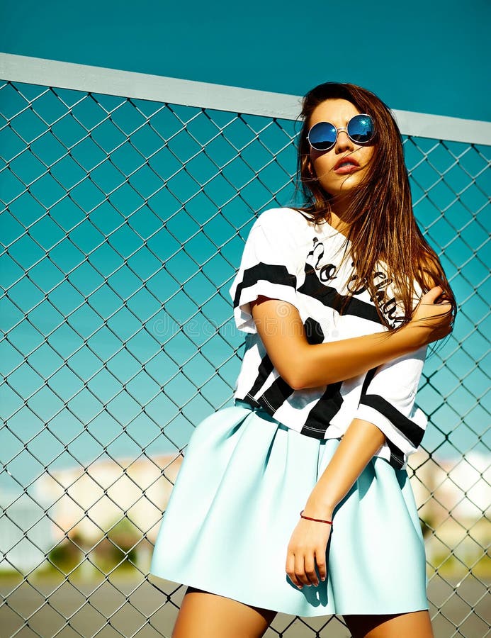 Funny crazy stylish model girl in the street in casual hipster summer cloth royalty free stock image