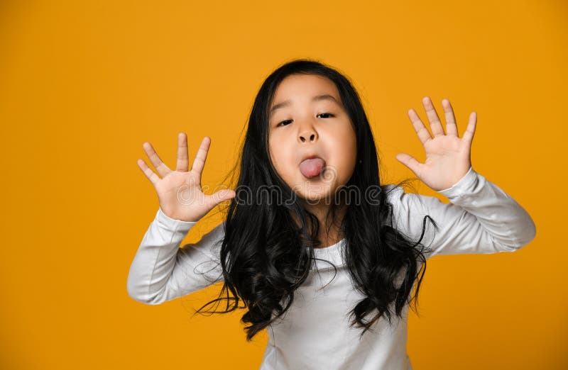 Funny Cute Little Asian Girl Shows the Tongue Stock Image - Image of happy,  beauty: 143492591