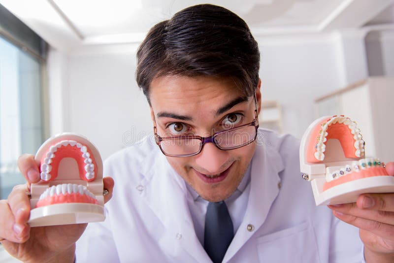 The Funny Dentist with Teeth Model in Hospital Stock Image Image of