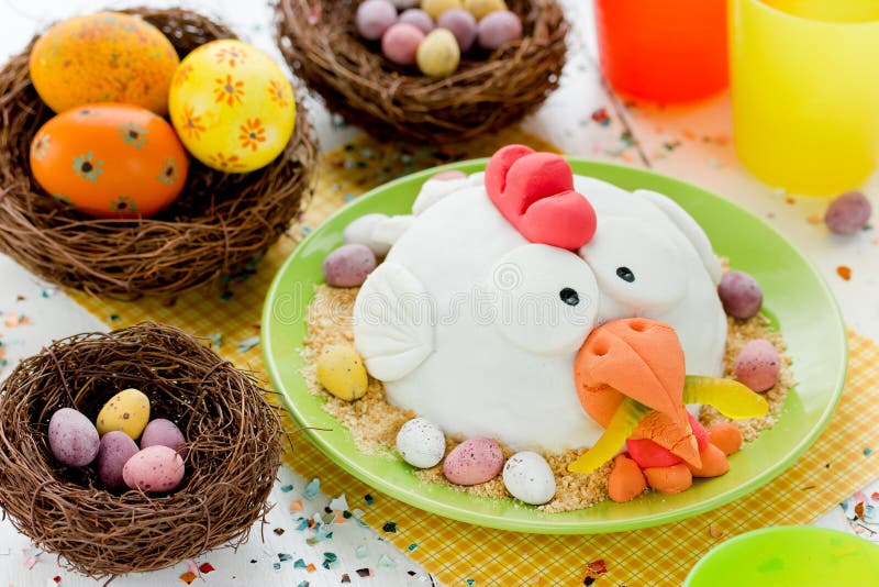Funny Easter cake decorated with marzipan shaped Easter chicken stock photo Funny Easter cake decorated with marzipan shaped Easter chicken stock photo