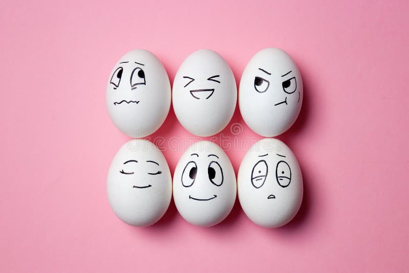 Funny Easter eggs with facial expressions. Eggs with different faces on pink background