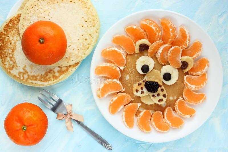 Funny edible lion mandarin tangerine pancakes