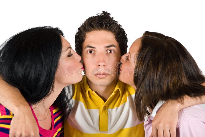 Sad young man being kissed by two beauty woman and he is surprised and hugging them,check also. Sad young man being kissed by two beauty woman and he is surprised and hugging them,check also