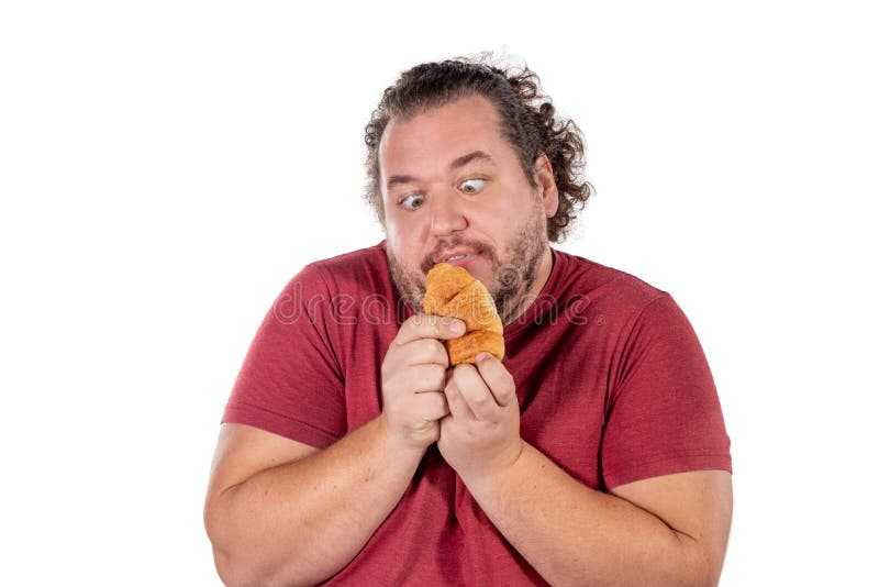 Funny Fat Man Eating Small Croissant On White Background. Good Morning