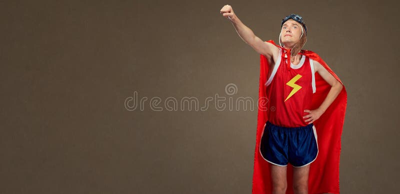 Funny funny cheerful man in a superhero costume in sports clothe. S. Humor in sport royalty free stock image Funny funny cheerful man in a superhero costume in sports clothe. S. Humor in sport royalty free stock image