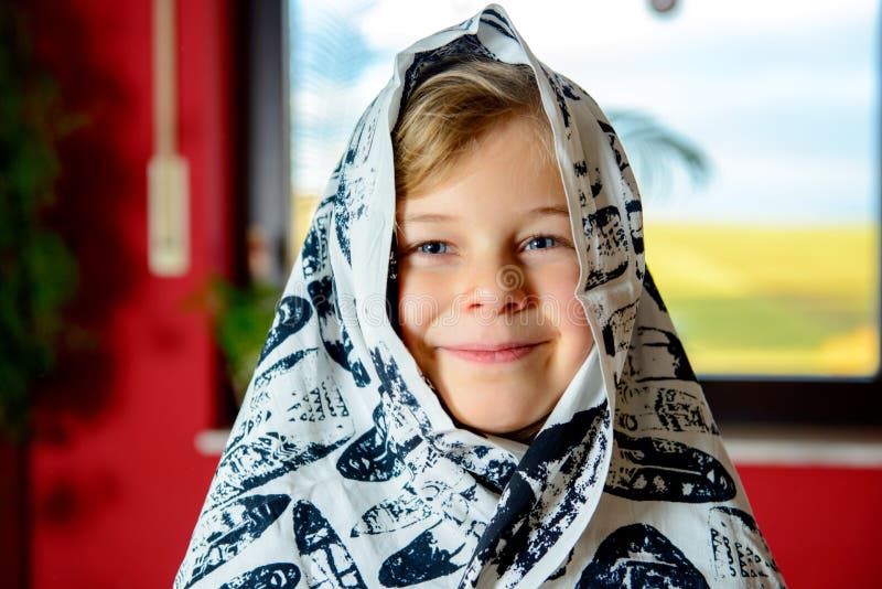 Funny girl with blanket on head