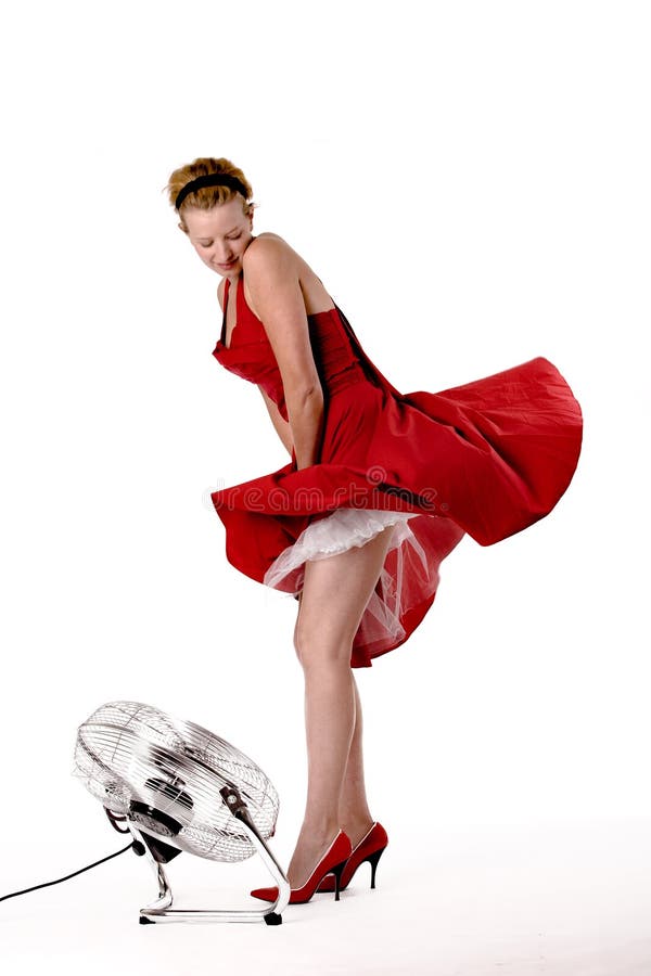 Funny girl in red gala dress playing