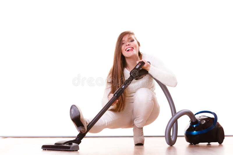 Funny girl with vacuum cleaner. Housework. Woman vacuuming the house. Funny girl with vacuum cleaner. Housework royalty free stock image Funny girl with vacuum cleaner. Housework. Woman vacuuming the house. Funny girl with vacuum cleaner. Housework royalty free stock image