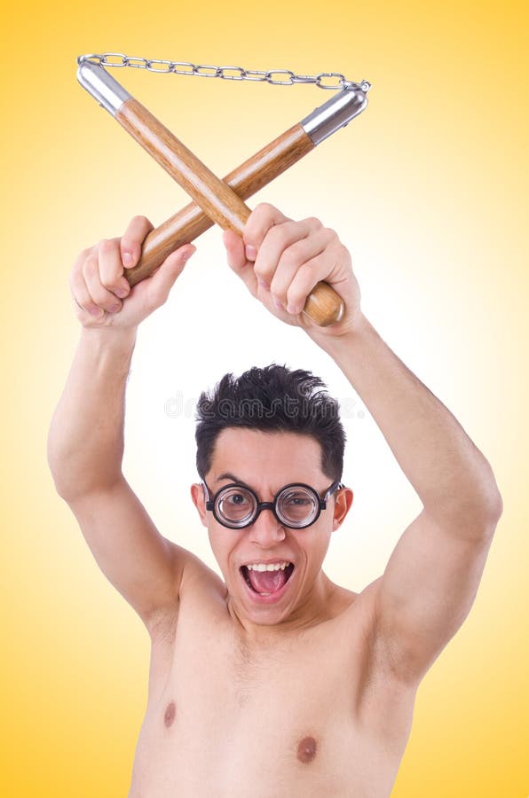 Funny guy with nunchucks stock photo. Image of person 46601164