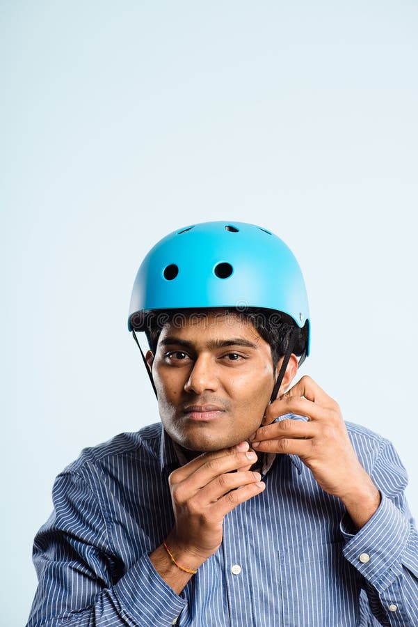 funny man wearing cycling helmet portrait real people high definition blue background stock photography funny man wearing cycling helmet portrait real people high definition blue background stock photography