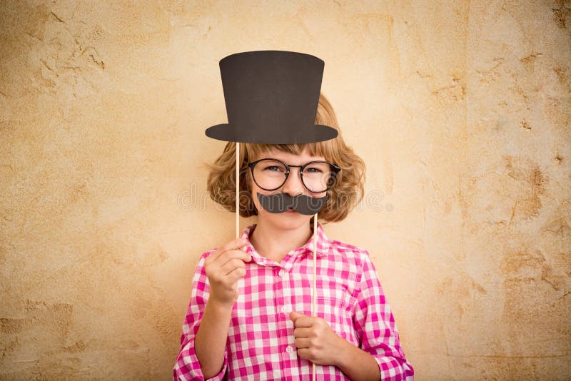 Funny kid with fake mustache stock photo Funny kid with fake mustache stock photo