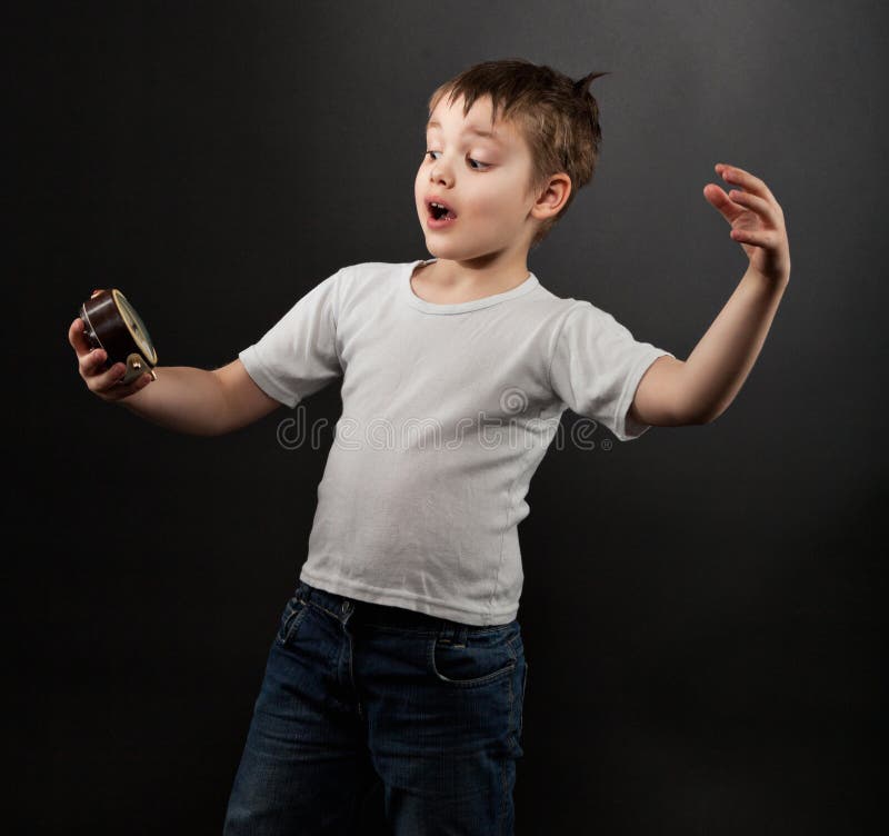 Funny Little Boy Looking at Alarm Clock Stock Photo Image of white