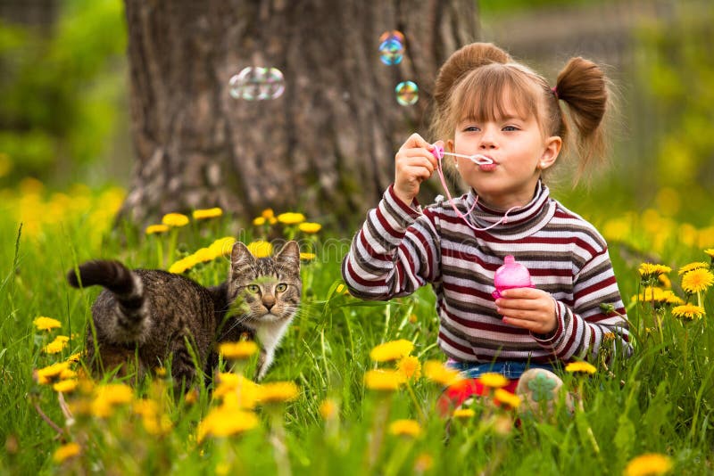 Funny lovely little girl and a cat