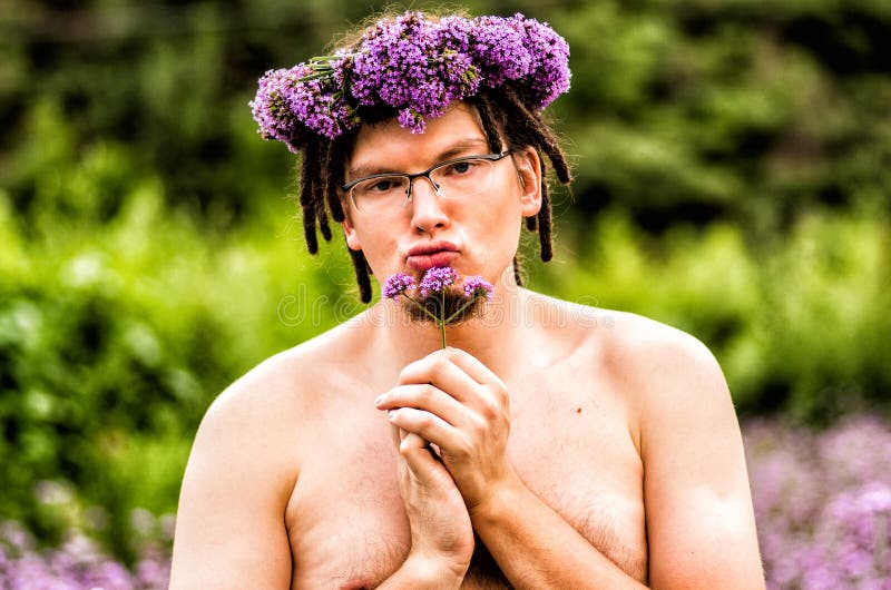 Funny Man with Dreadlocks Holds a Flower Stock Photo Image of