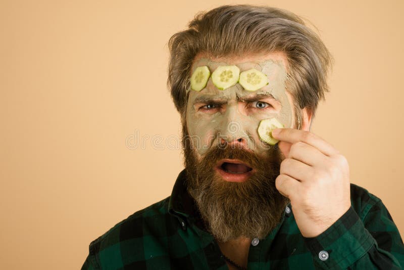 Funny Man with Facial Mask. Man Getting Facial Care with Cucumber Stock ...
