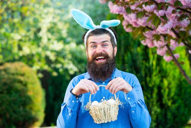 Funny Man Hunting Easter Eggs. Portrait of Easter Man Holds Basket with