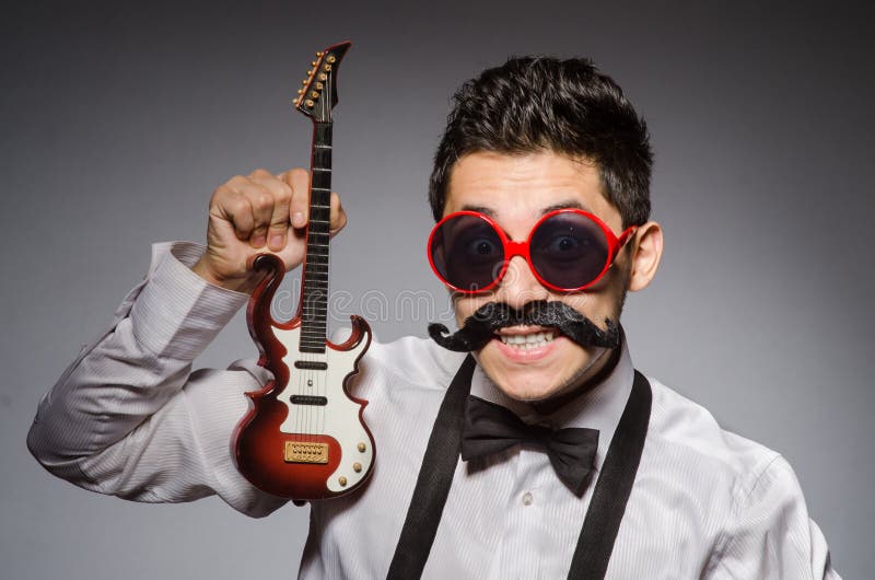Funny man. With mini guitar royalty free stock images Funny man. With mini guitar royalty free stock images