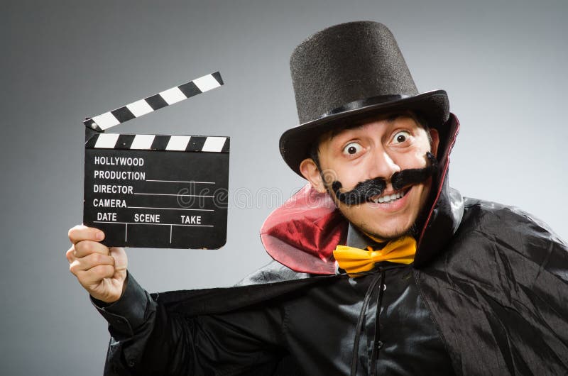 Funny man with movie clapboard. The funny man with movie clapboard royalty free stock photo Funny man with movie clapboard. The funny man with movie clapboard royalty free stock photo