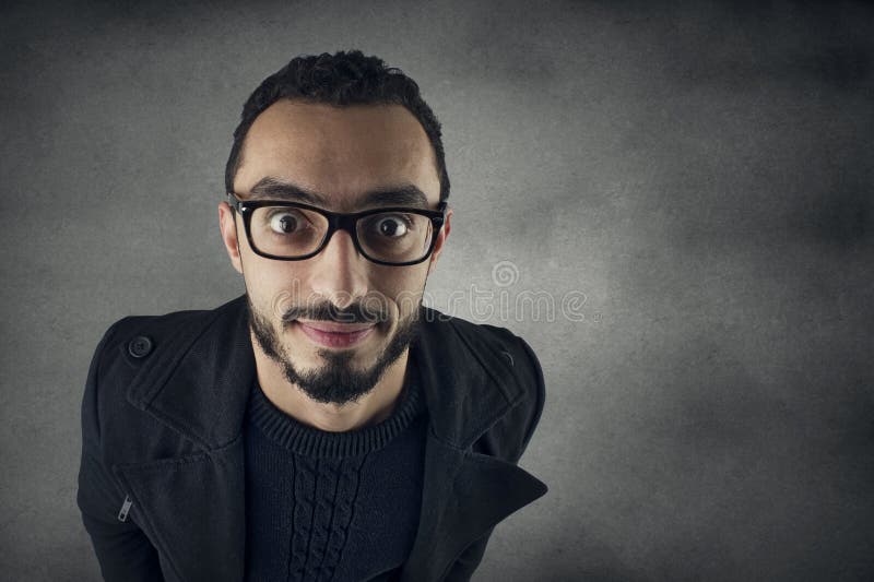 Funny man with Nerd glasses smiling, wide angle shot royalty free stock image