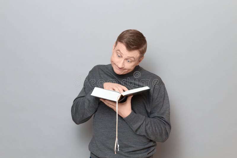 Funny Man is Reading Book with Bewilderment and Silly Expression Stock  Image - Image of optimistic, expression: 196800773