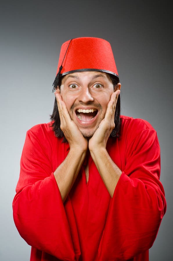 Funny man in red dress wearing