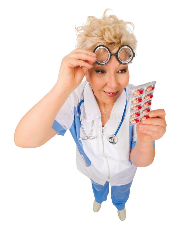 Funny mature doctor in nerd glasses with pills