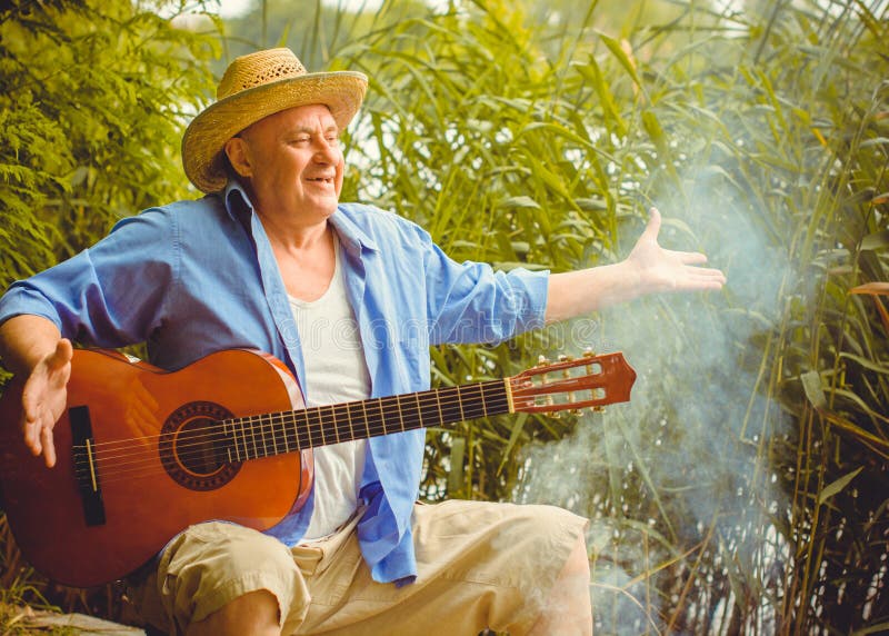 Funny Older Man in Print Shirt Tourist Playing Guitar Stock Photo - Image  of latin, grass: 219987086