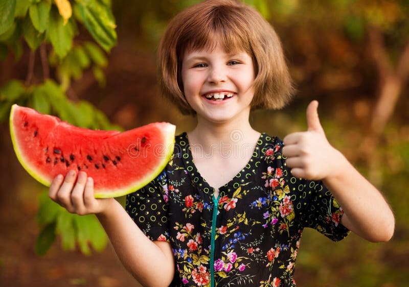 Funny Portrait of Incredibly Beautiful Little Girl Eating Watermelon