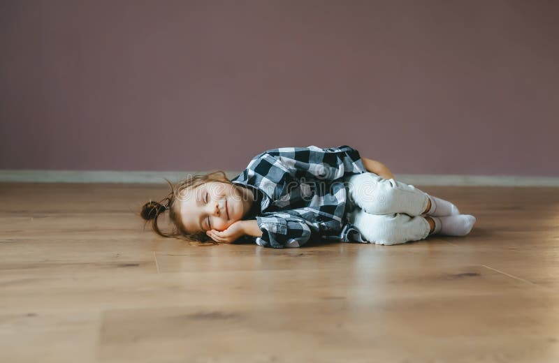 Funny Portrait of Lying Cute Little Girl on a Floor Indoors Stock Image ...