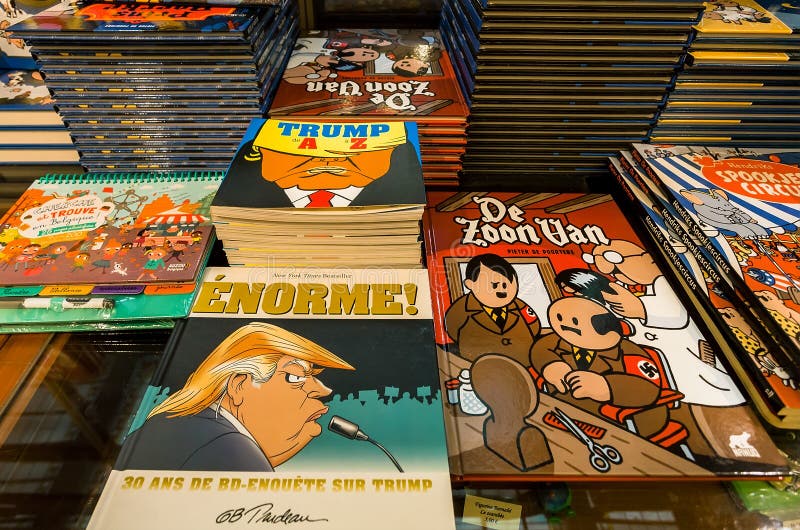 BRUSSELS, BELGIUM: Funny portrait of USA president Donald Trump on cover of new book, and comics magazines for sale in a bookstore on April 2, 2018. Near 1,200,000 people lives in Brussels