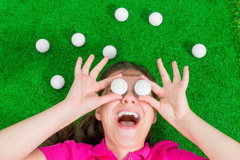 Funny portrait of a woman with golf balls