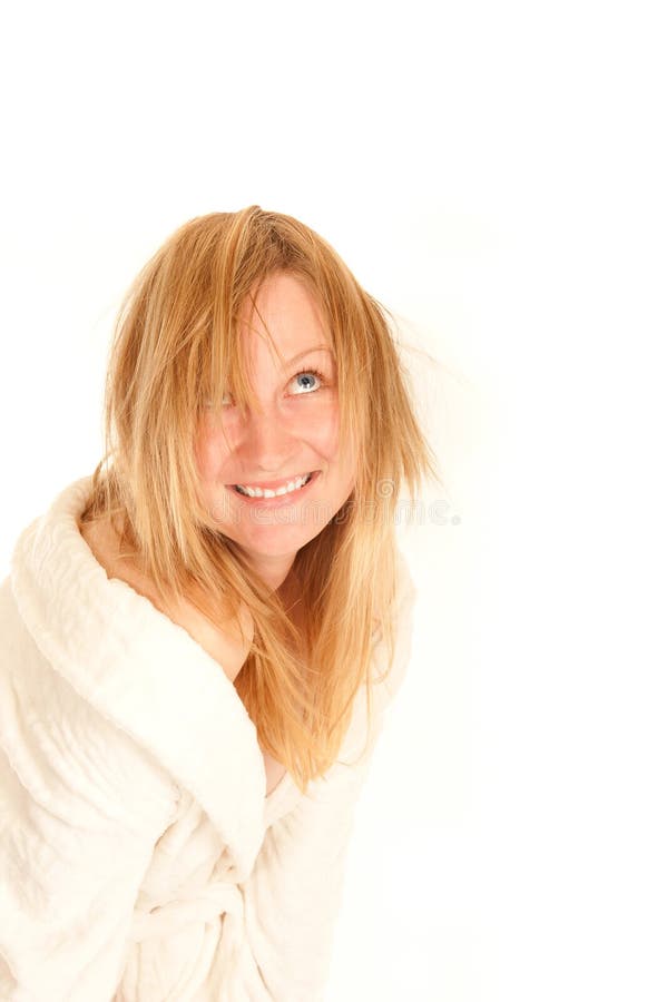 Funny portrait of a young female in bathrobe stock image