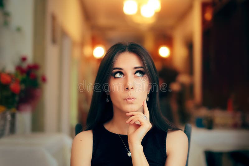 Cute Girl Thinking about Her Plan at Dinner Party stock photo Cute Girl Thinking about Her Plan at Dinner Party stock photo