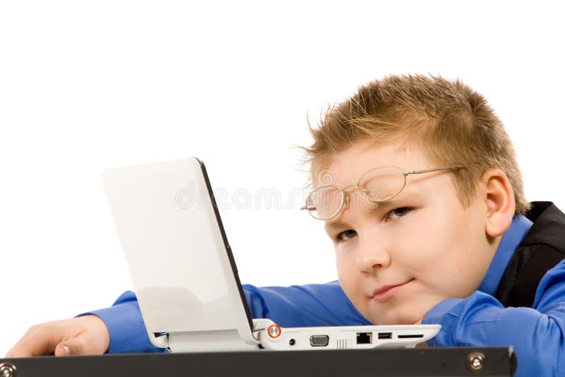 Funny school boy with laptop isolated on white royalty free stock photos