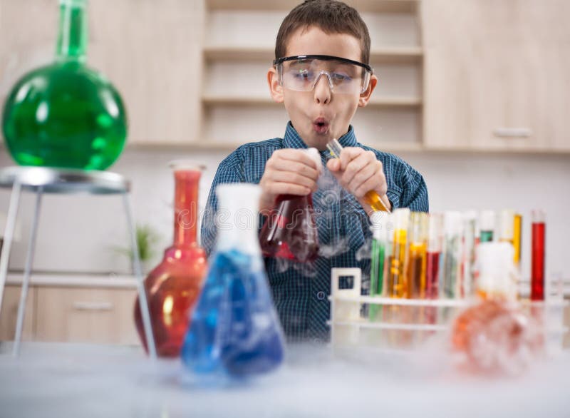 Little boy working in chemistry lab. Little boy working in chemistry lab