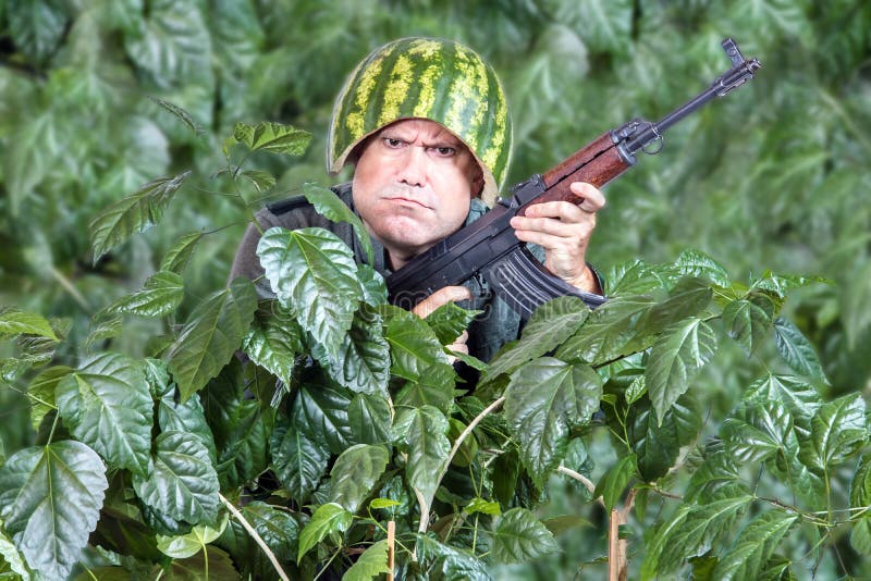 Funny Soldier with a Machine Gun Stock Photo - Image of cover, flower:  112101706
