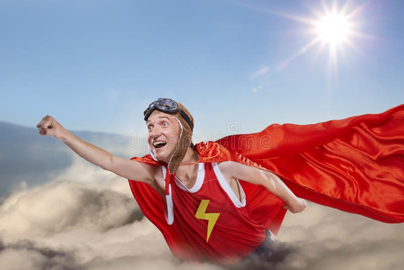 A funny super hero fly above the clouds in the sky