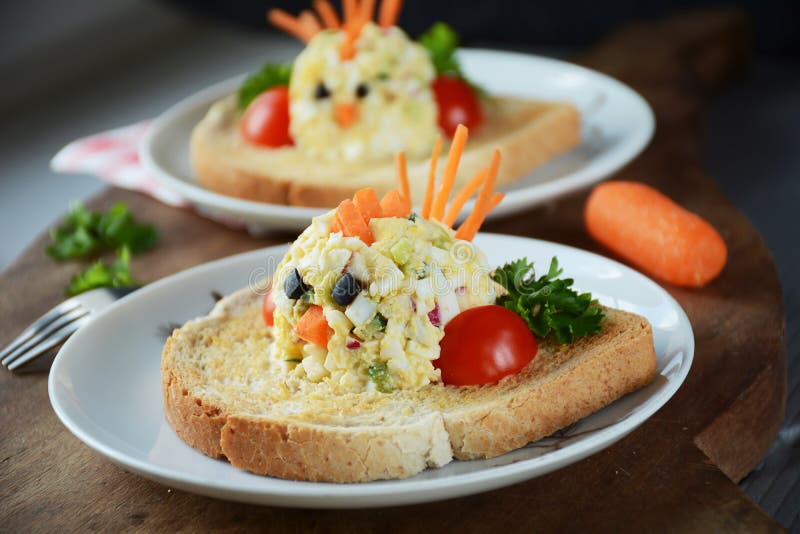 Funny toasts with egg salad for kids