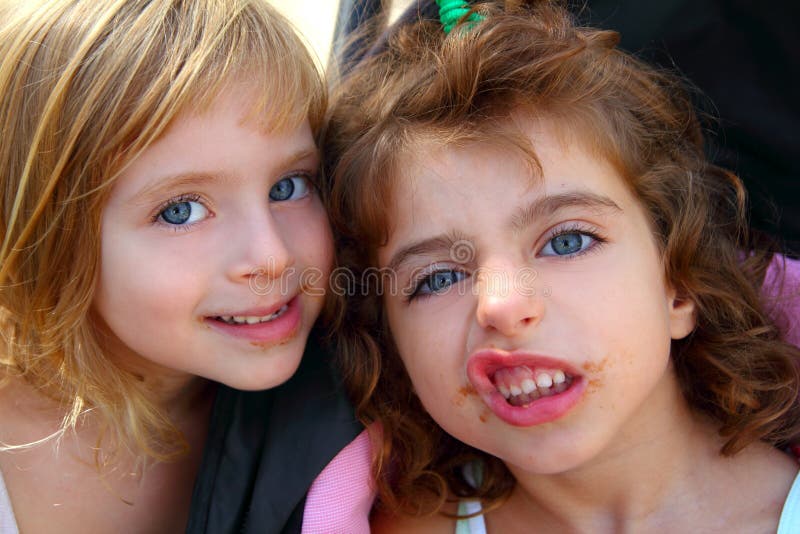 Funny two little sister girls funny face gesture. Dirty mouth royalty free stock image Funny two little sister girls funny face gesture. Dirty mouth royalty free stock image
