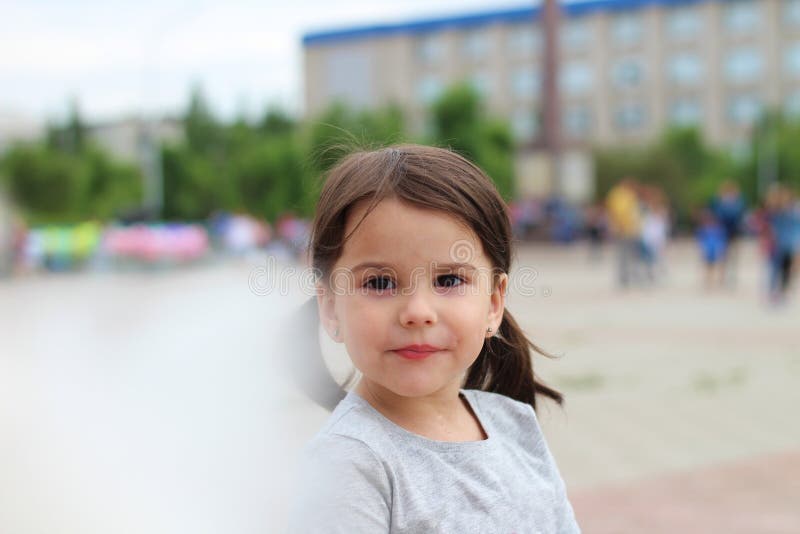 funny white girl with pigtails with cotton candy in hand on a city holiday stock photo funny white girl with pigtails with cotton candy in hand on a city holiday stock photo