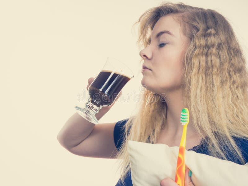 Funny woman being late drinking coffee stock photo Funny woman being late drinking coffee stock photo