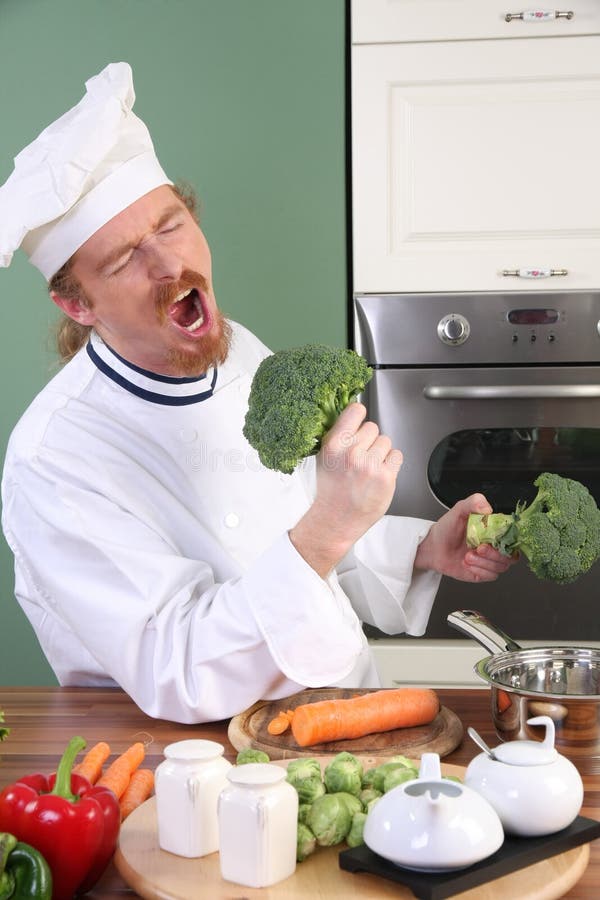 Funny young Chef with broccoli