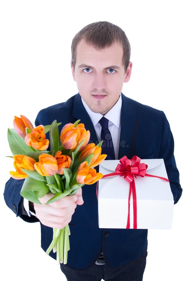Funny Young Man with Bunch of Flowers and Gift Box Isolated on W Stock