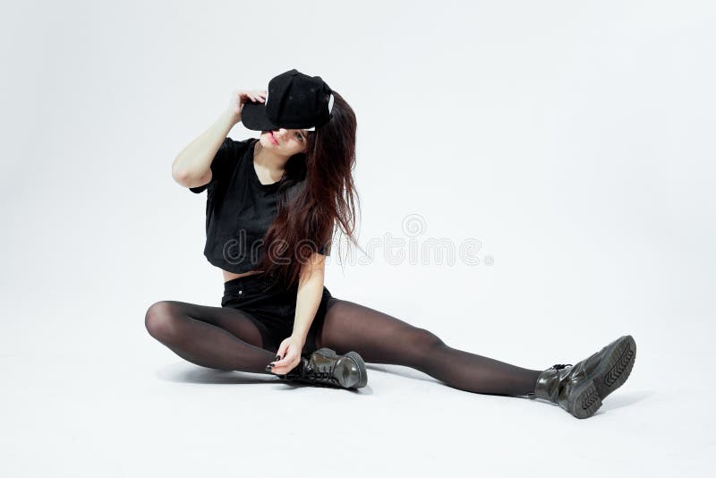 https://thumbs.dreamstime.com/b/funny-young-stylish-girl-dressed-black-top-shorts-tights-cap-sits-floor-white-background-funny-young-140281148.jpg