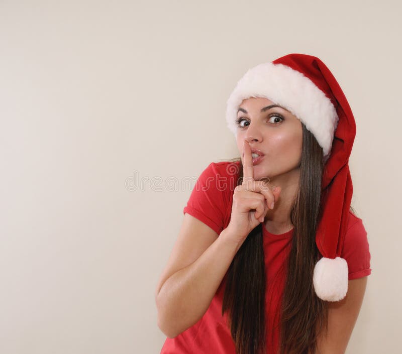 Cute Young Woman in Santa Hat Dreaming of Christmas Gift Stoc picture picture