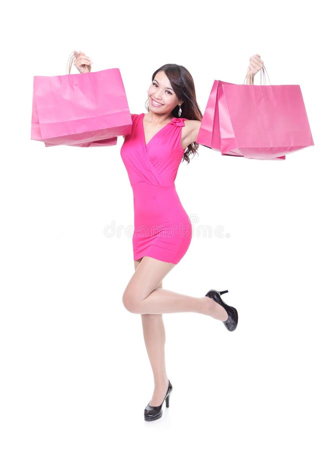 Funzionamento felice della giovane donna di acquisto immagine stock libera da diritti Funzionamento felice della giovane donna di acquisto immagine stock libera da diritti