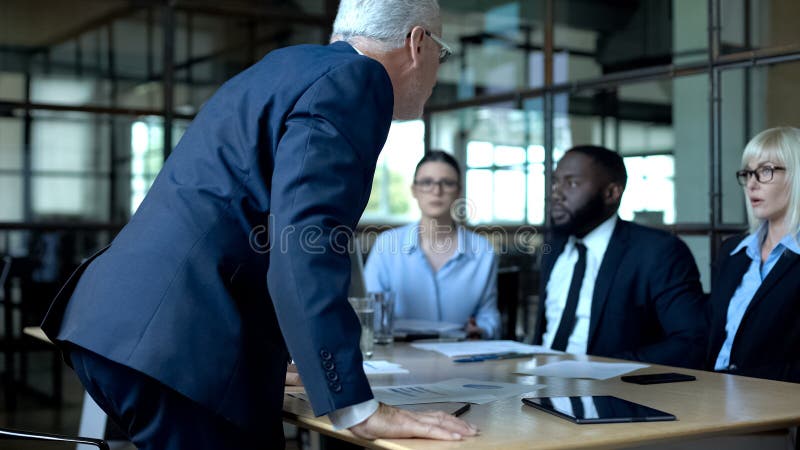 Furious boss mad at company employees, stressful job, lack of business ethics royalty free stock image Furious boss mad at company employees, stressful job, lack of business ethics royalty free stock image