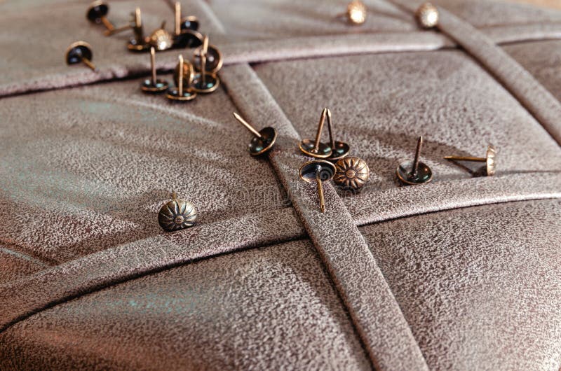 Furniture decorative nails on the background of fabric upholstery stock photos Furniture decorative nails on the background of fabric upholstery stock photos
