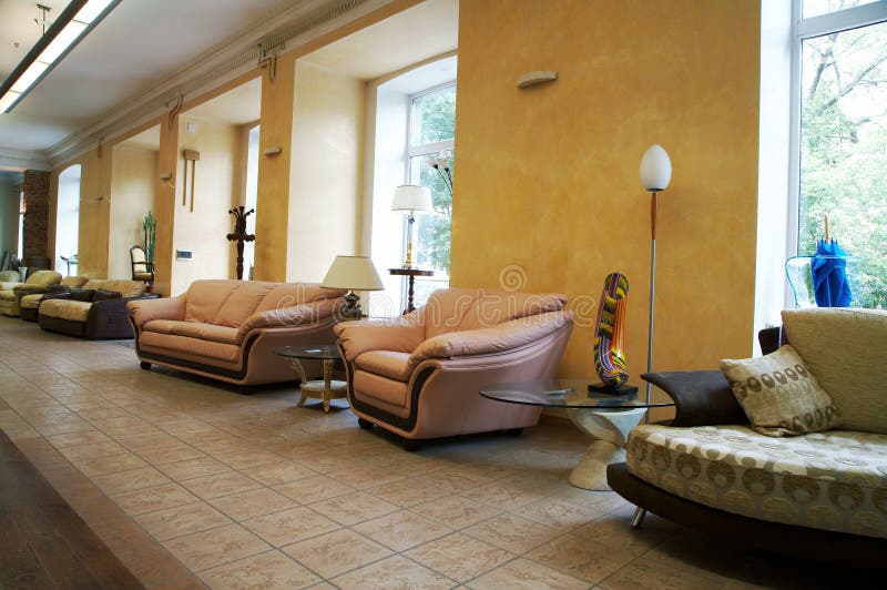 Leather Couch and Armchair in Furniture Store Editorial Stock Image